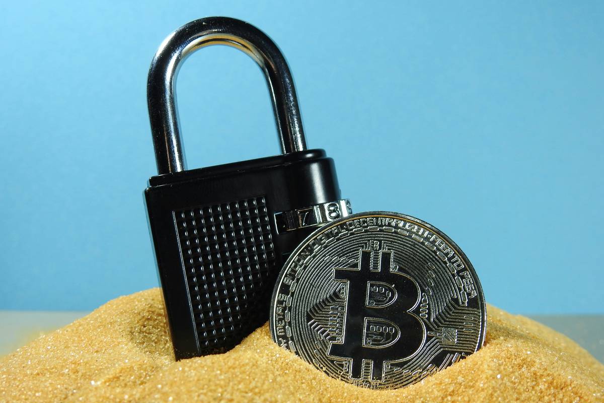 bitcoin wallet security: illustration of a locked digital vault with Bitcoin symbols and shield icon
